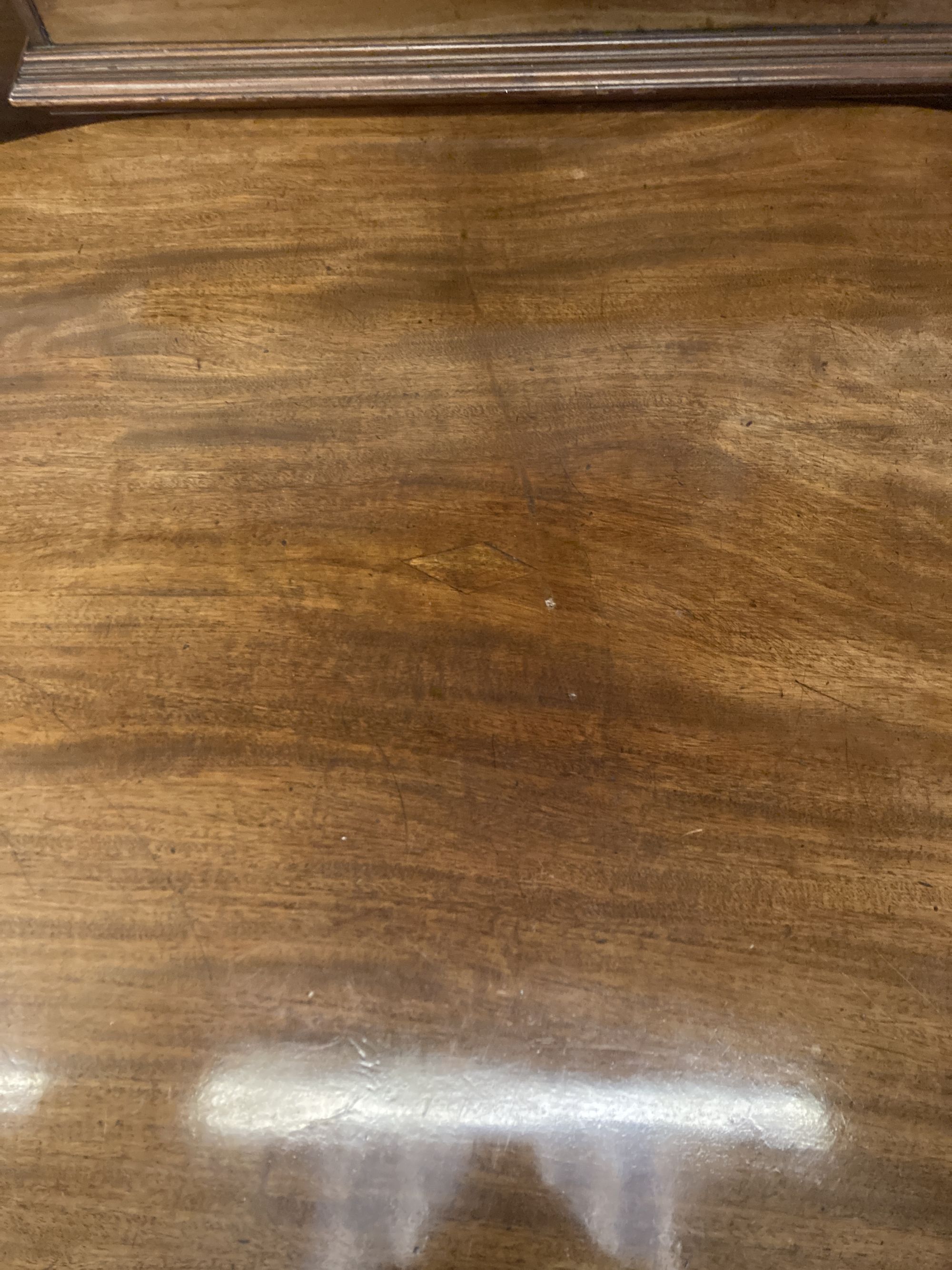 A George III oval mahogany tilt top dining table, width 158cm depth 120cm height 74cm